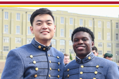 Two male students, known as cadets at VMI, pose for a photo during Graduation celebrations.