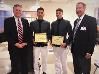 Jung Soo Lee ’18 and David Zingaro ’20 receiving certificates for their work with CAFR