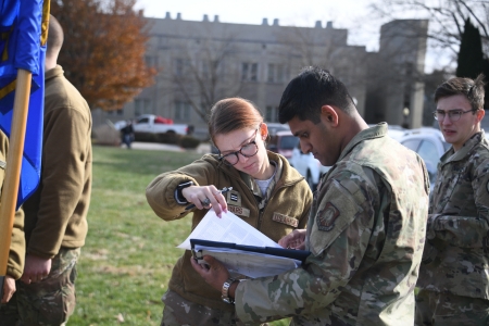 Air Force ROTC cadets review notes before their turn on a helicopter flight over Virginia Military Institute.