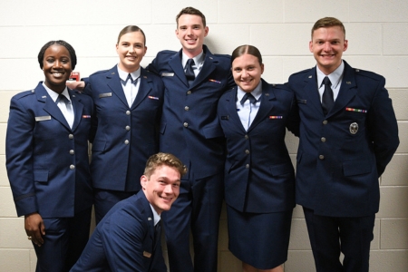 Air Force ROTC cadets pose before their commissioning ceremony where they will become Second Lieutenants.