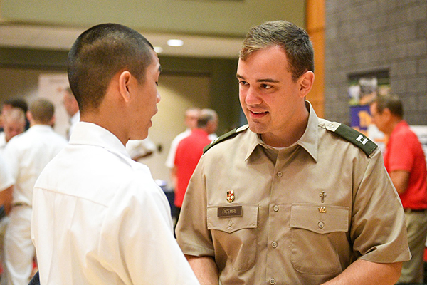 Chaplain (Captain) Eli B. D. Facemire ‘19 speaks with a new member of the VMI Corps of Cadets during Rat Sunday.