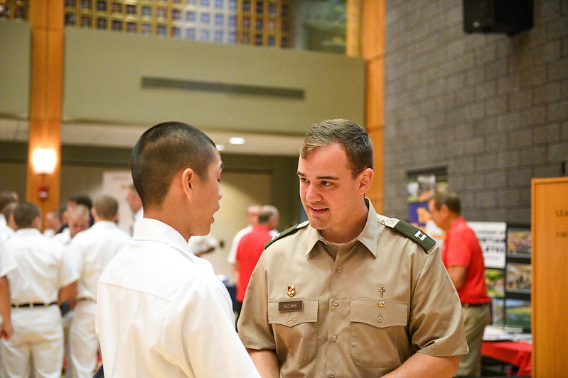 Associate Chaplain Facemire speaks with a freshman at VMI.