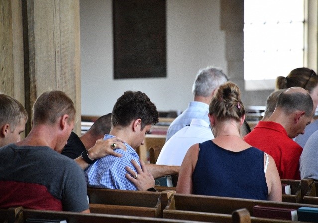 Incoming rats and their families gather for a prayer service on Matriculation Day at VMI.