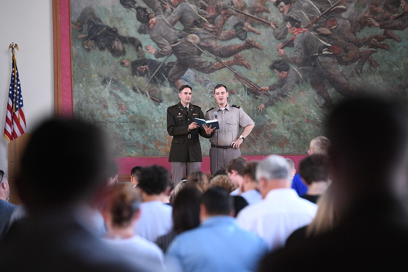 VMI's chaplain and associate chaplain speak to incoming students and their families in Memorial Hall.