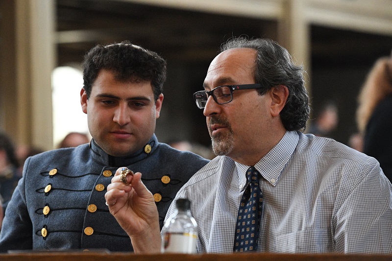 A father examines his son's VMI class ring in Memorial Hall during the Ring Blessing hosted by the Chaplain's Office.