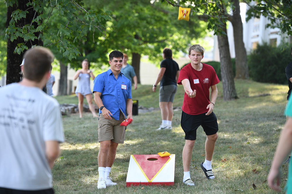 Incoming students enjoy a game of cornhole at the STP Picnic hosted by VMI's Office of the Chaplain.