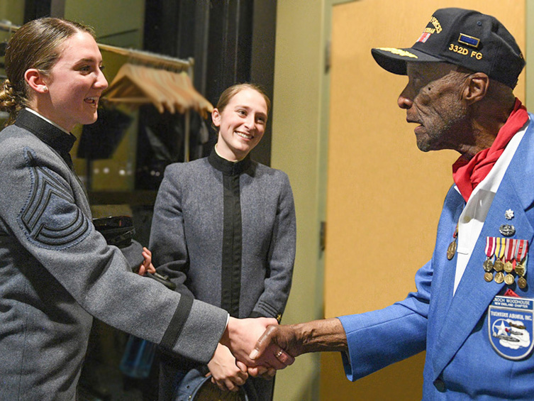 Lt. Col. Enoch “Woody” Woodhouse II shaking hands with Alexandra Sassaman ’22