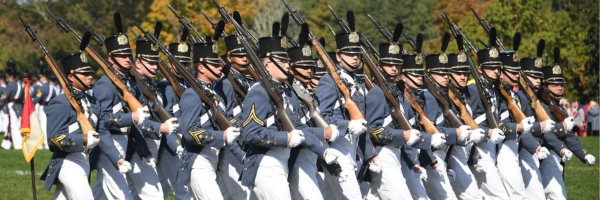 Cadets march with rifles on shoulders during a fall parade at VMI.
