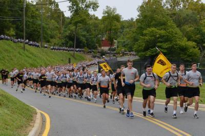 Cadets run down Saunders Drive during the 9/11 memorial group run.