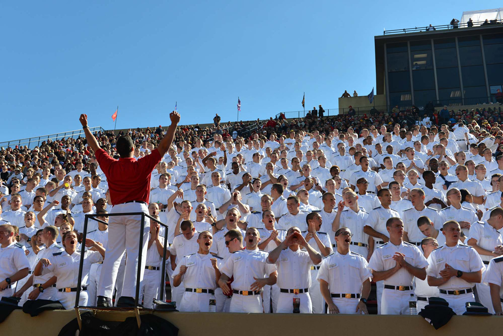 A large crowd cheers on the Keydets during a home football game.