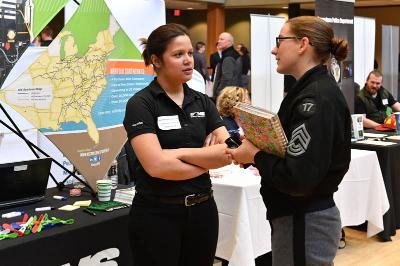 Sarah Hoover ’13, representing Norfolk Southern Corporation at the career fair, speaks with Allison Partin ‘17. – VMI Photos by Kelly Nye.  