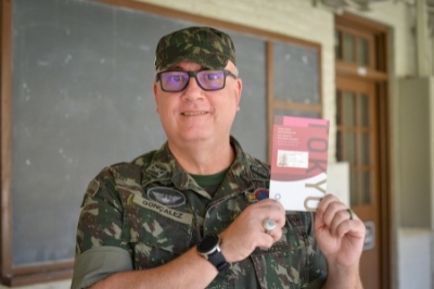Col. Marcelo Goncalez, a member of VMI's Commandant's staff holds his credentials for the Tokyo Olympics.