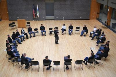 VMI cadets faculty and staff sitting in a circle attending the Braver Angels debate