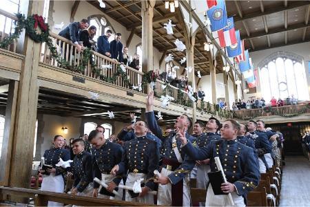 Cadets throw their gloves in celebration of their commencement.—VMI Photo by H. Lockwood McLaughlin
