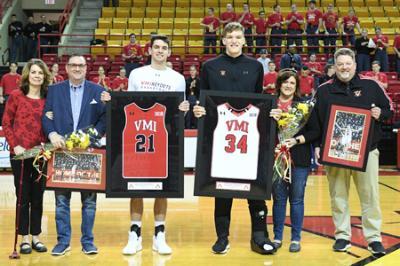Jake Stephens ’22 and Connor Arnold ’22 are joined by their families in Cameron Hall while they are recognized during senior night Feb. 23.—VMI Photo by H. Lockwood McLaughlin.