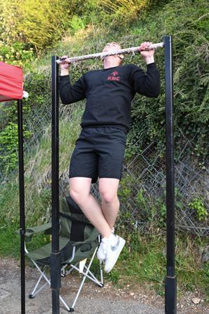 Matthew Ehret ’22 completes a pull-up on a bar at the outdoor track.—VMI Photo by H. Lockwood McLaughlin.