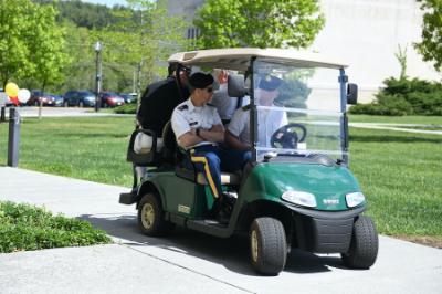 Students from VMI work a computer controlled golf cart on the military school's campus in Lexington, Virginia