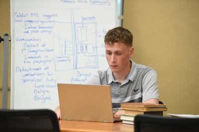 Jack Conley '25 researching the hand-written letter, along with other ancient tablets, for his Summer Undergraduate Research Institute (SURI) project titled, “The Vindolanda Tablets: Understanding the Roman Frontier in Northern Britain.”
