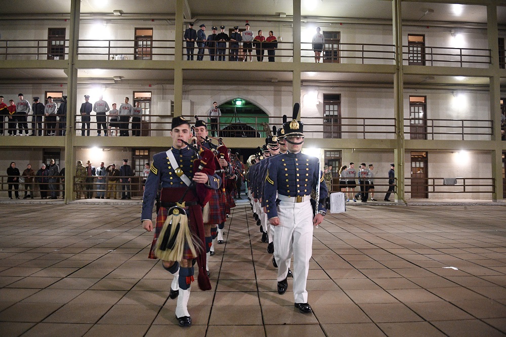 Members of the Regimental Band and the Pipe Band march into barracks for the tribute to Capt. Jack Casey ’19.