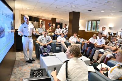 Brian Pritchard ’25 explains the VMI regimental system to cadets from other senior military colleges during the conference in September.