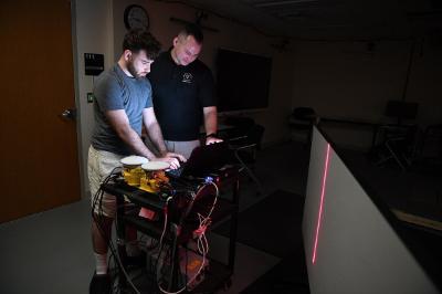 Bruce Hay ’25 and Maj. Craig Altmann work with the off-road laser measurement mapping system. –VMI Photo by Kelly Nye.