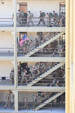 Cadets ascend and descend the steps in barracks from 1st stoop to 4th stoop